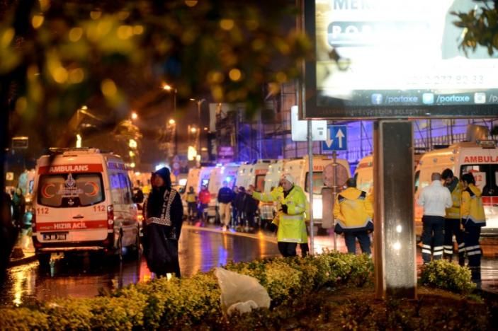 Ambulances line up on a road leading to a nightclub where a gun attack took place during a New Year party in Istanbul