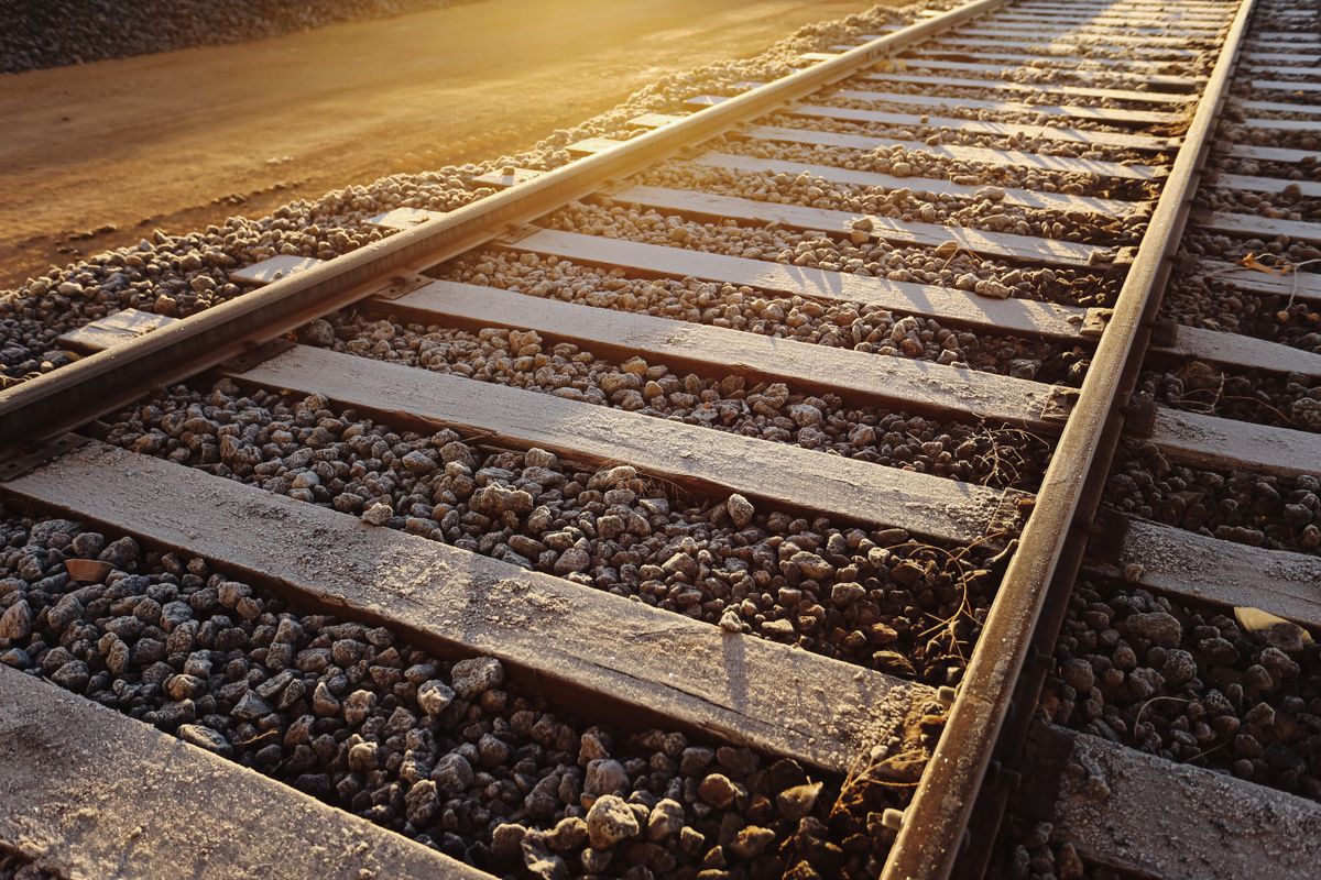 Railway,Tracks,At,Sunset,With,Warm,Golden,Light.,Steel,Rails